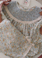 Load image into Gallery viewer, RESTOCK PRE-ORDER: GIRLS FLORAL PANTS SET WITH LACE, SMOCKING, PEARLS, AND SATIN BOWS
