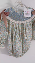 Load and play video in Gallery viewer, GIRLS FLORAL BUBBLE WITH CREAM LACE, SMOCKING, PEARLS, AND BROWN SATIN BOWS

